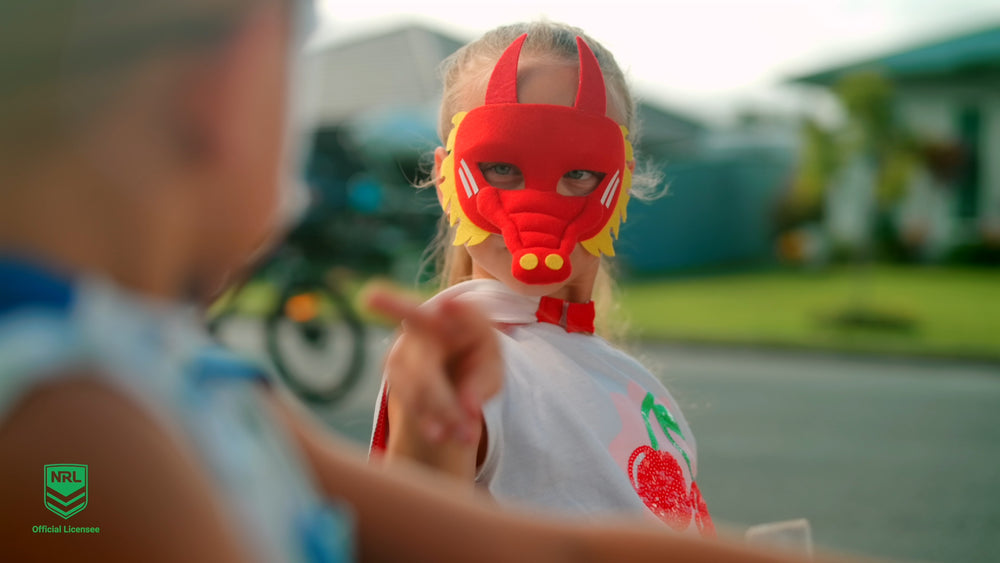 Girl wearing the St. George Illawarra Dragons NRL mask an youth support cape