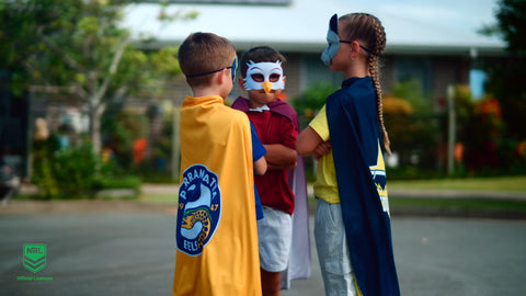 kids wearing the mini mascot NRL masks and youth supporter capes