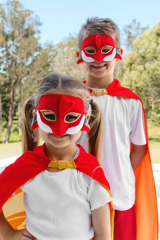 girl and boy wearing the Dolphins NRL Mask and youth supporter cape